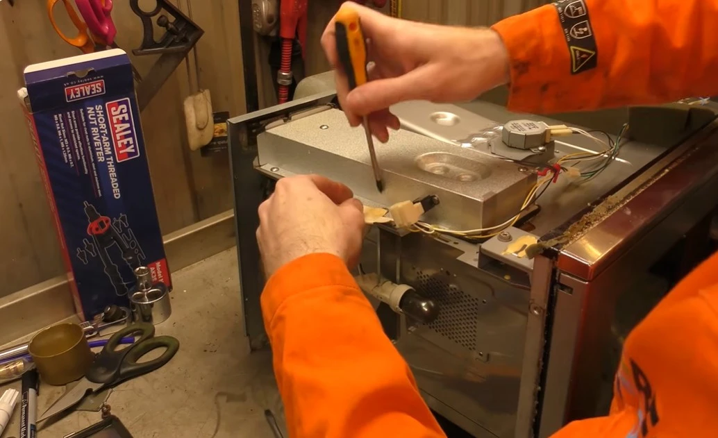 Technician diagnosing an appliance for a Potosi, Texas home