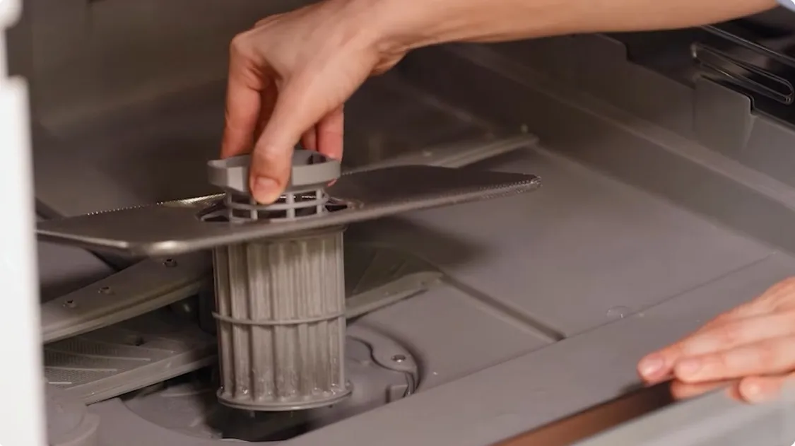 Technician diagnosing appliance repair issue