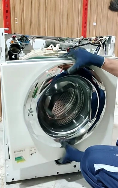 Technician repairing a Whirlpool washer in Abilene, Texas